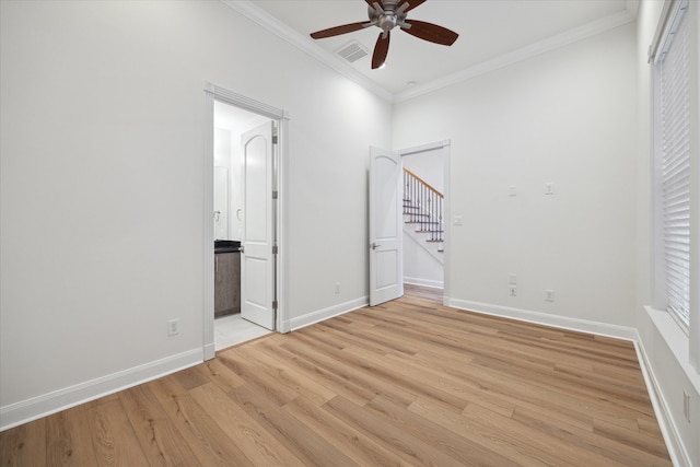 unfurnished bedroom with light hardwood / wood-style floors, ceiling fan, and crown molding