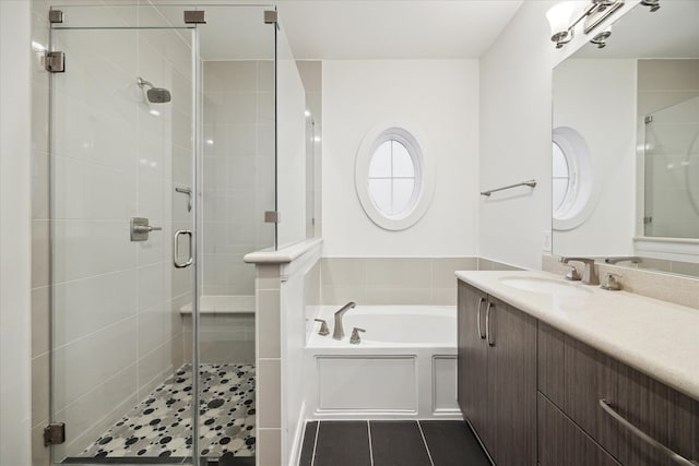 bathroom featuring vanity, tile patterned floors, and plus walk in shower