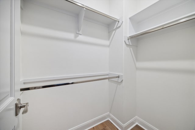 walk in closet featuring wood-type flooring