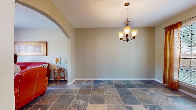 interior space featuring a notable chandelier