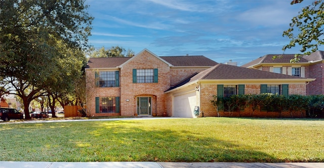 view of front of house with a garage and a front lawn