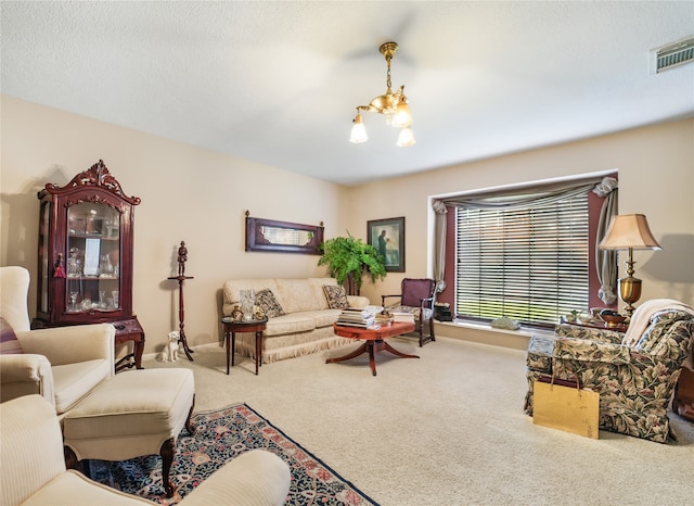 carpeted living room featuring a notable chandelier