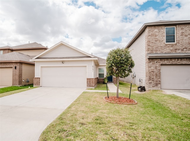 view of front of house featuring a garage and a front lawn