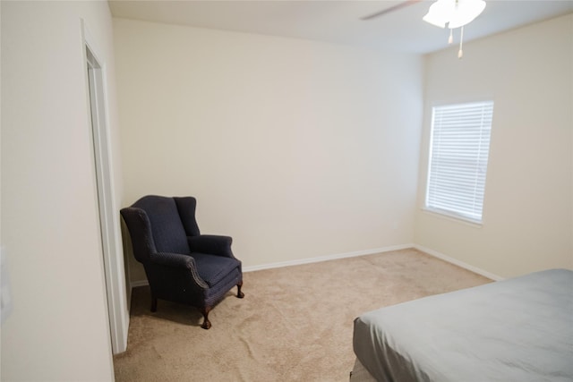 bedroom with multiple windows, light carpet, and ceiling fan