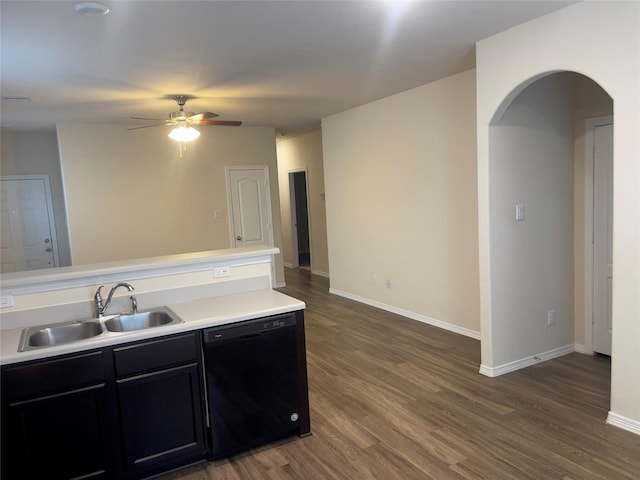 kitchen featuring ceiling fan, dark hardwood / wood-style flooring, black dishwasher, and sink