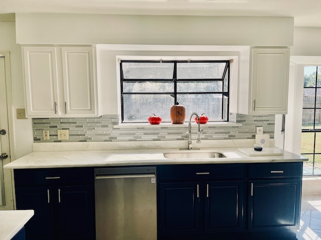 kitchen featuring white cabinetry, dishwasher, and sink