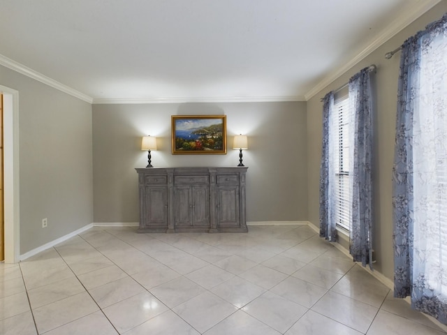 empty room with crown molding and light tile patterned flooring