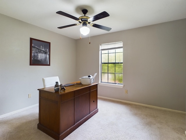 unfurnished office with light carpet and ceiling fan