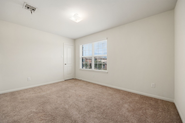 spare room featuring carpet flooring