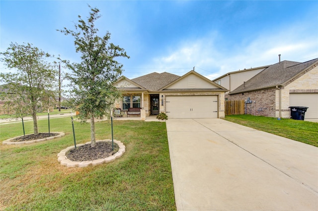 view of front of house featuring a front yard and a garage