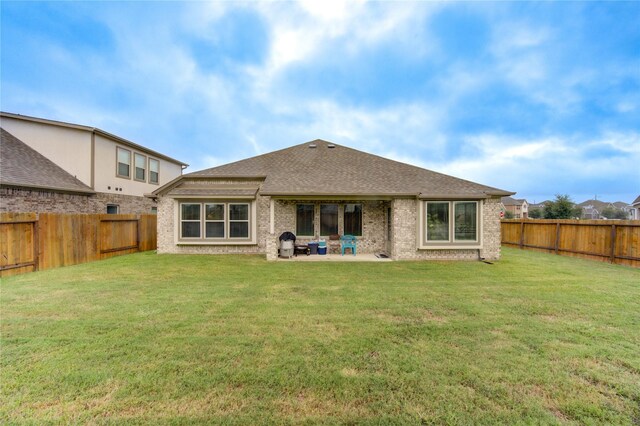 2446 Wembley Way, Rosenberg, TX 77471 - back of house with a patio, roof with shingles, and brick siding