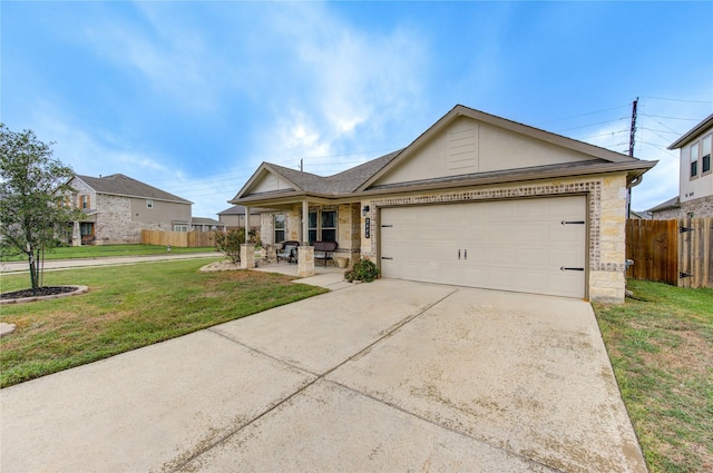 2446 Wembley Way, Rosenberg, TX 77471 - single story home featuring stone siding, driveway, a garage, covered porch, and roof with shingles