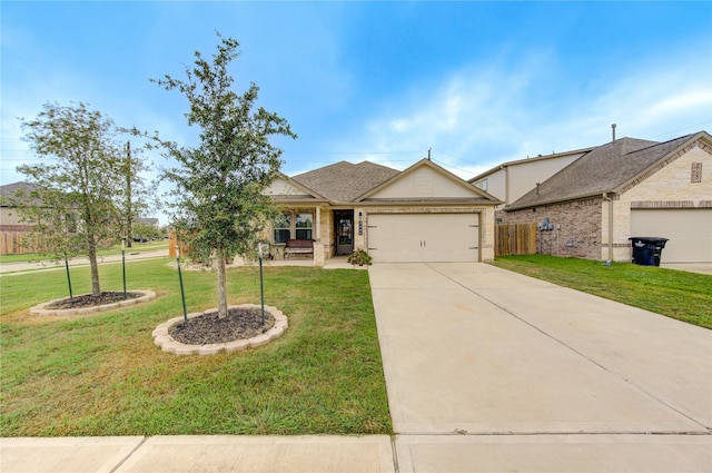 2446 Wembley Way, Rosenberg, TX 77471 - view of front of house featuring an attached garage, concrete driveway, and a porch