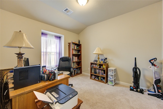 office with light carpet and vaulted ceiling