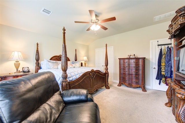 carpeted bedroom with lofted ceiling and ceiling fan