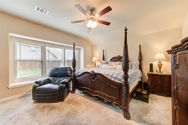 carpeted bedroom featuring lofted ceiling and ceiling fan