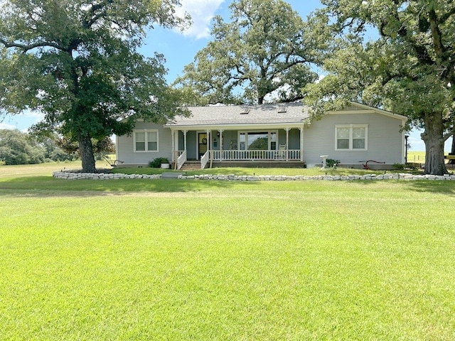 ranch-style home with a front lawn and a porch