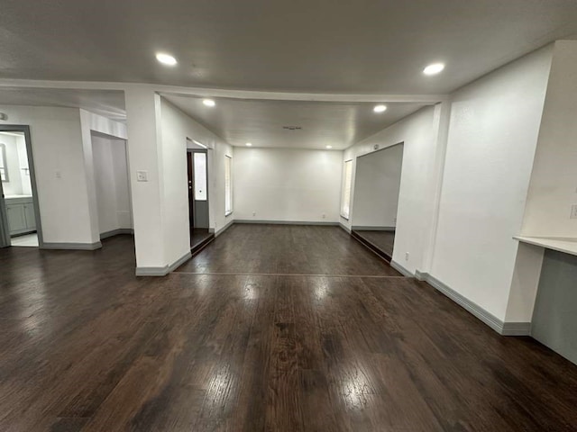 spare room with dark wood-type flooring