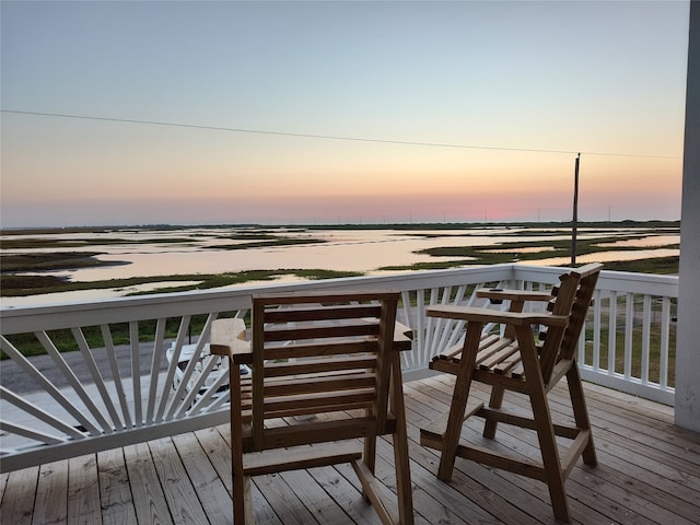 deck at dusk with a water view