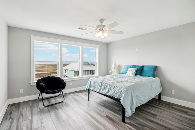 bedroom featuring hardwood / wood-style flooring and ceiling fan