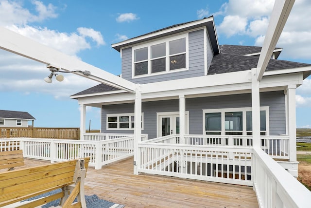 555 Pompano Dr Unit Q, Freeport, TX 77541 - rear view of property with a wooden deck and roof with shingles