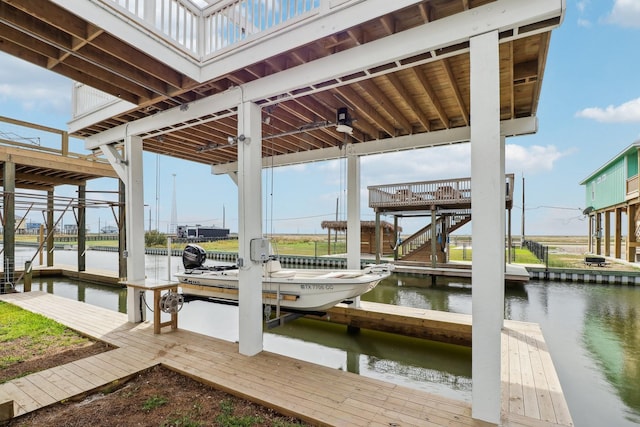 555 Pompano Dr Unit Q, Freeport, TX 77541 - view of dock featuring boat lift and a water view