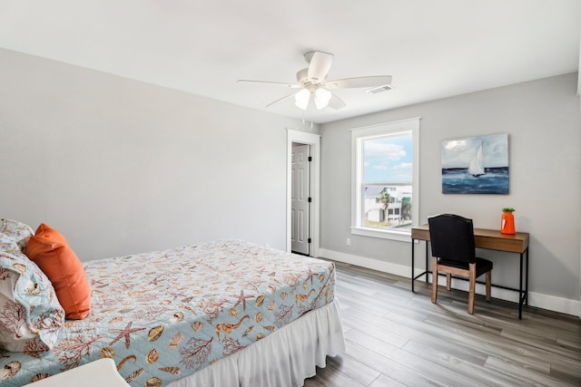 bedroom featuring hardwood / wood-style floors and ceiling fan