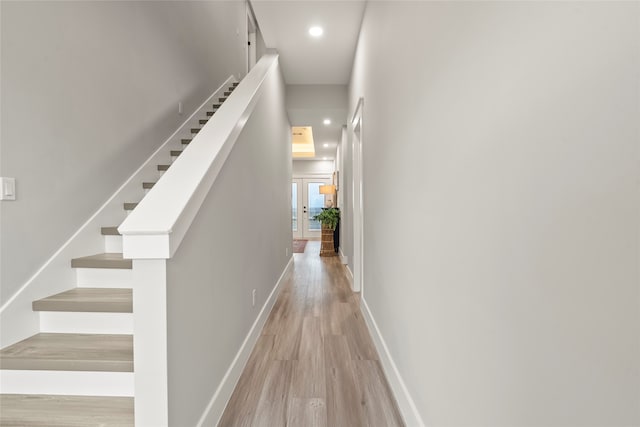 corridor with light hardwood / wood-style flooring