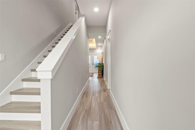 555 Pompano Dr Unit Q, Freeport, TX 77541 - corridor with light wood finished floors, french doors, baseboards, recessed lighting, and stairs