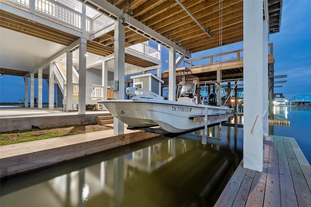 555 Pompano Dr Unit Q, Freeport, TX 77541 - view of dock featuring boat lift and a water view