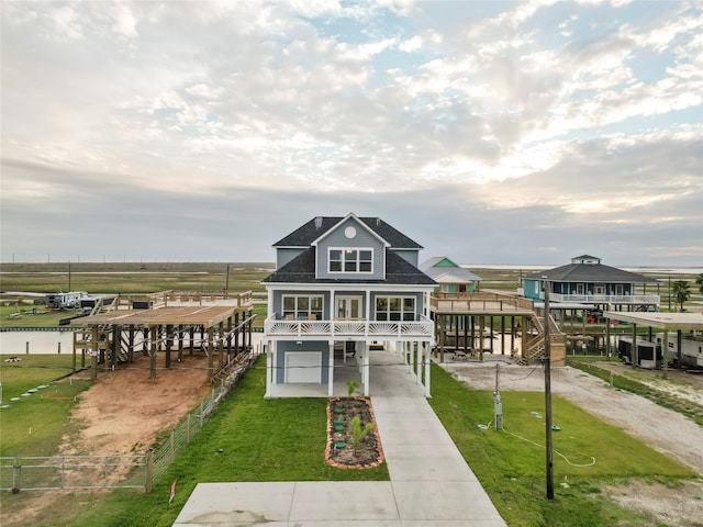 view of front of house featuring a front yard and covered porch