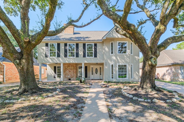 colonial inspired home featuring a porch