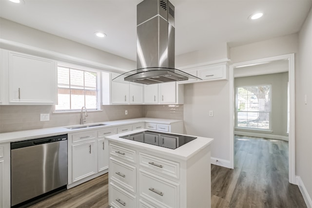 kitchen with island exhaust hood, white cabinets, stainless steel dishwasher, black electric stovetop, and sink