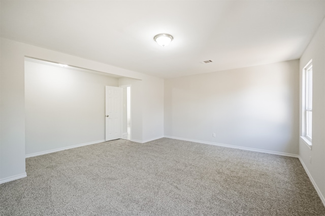 unfurnished room with carpet flooring