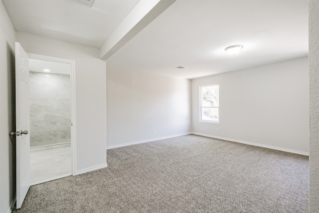 unfurnished room with carpet flooring