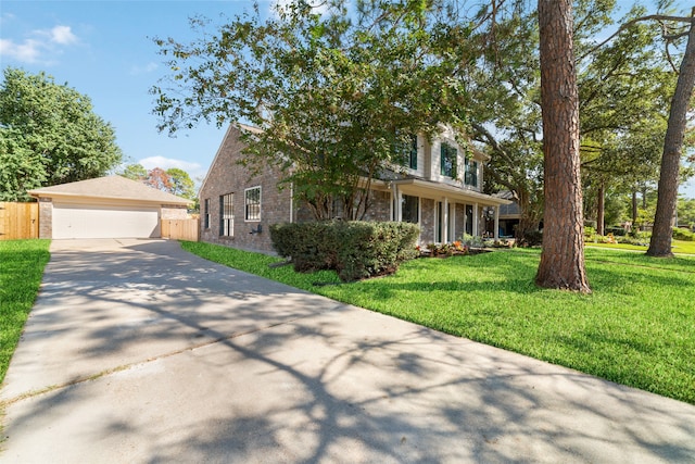 view of front facade with a garage and a front lawn