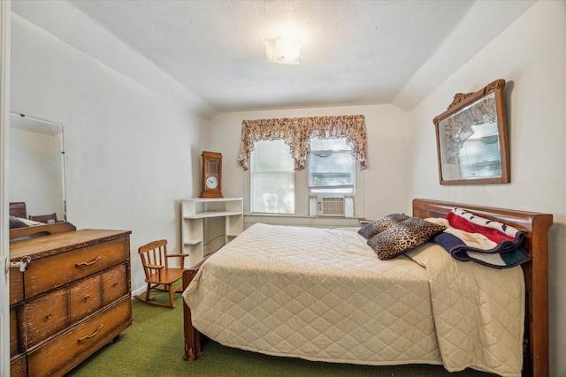 bedroom with lofted ceiling, a textured ceiling, cooling unit, and carpet flooring