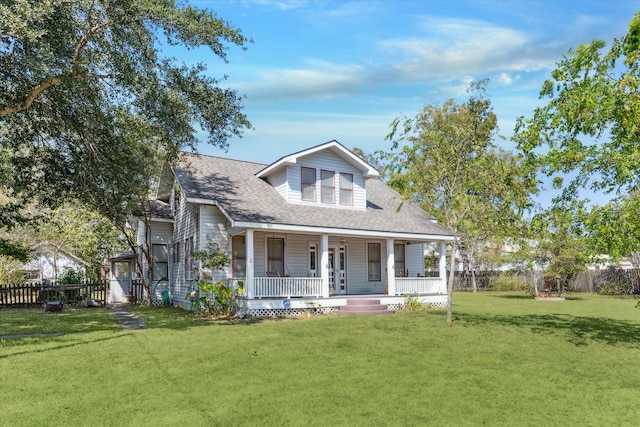 view of front of home featuring a front yard and a porch