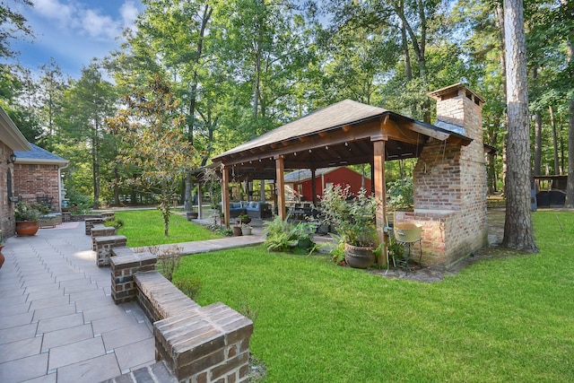 surrounding community with a gazebo, a patio, and a lawn