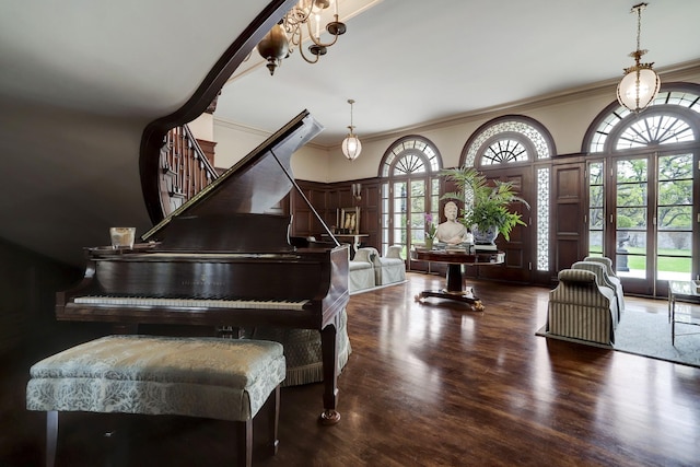 sitting room featuring crown molding, french doors, stairway, and wood finished floors