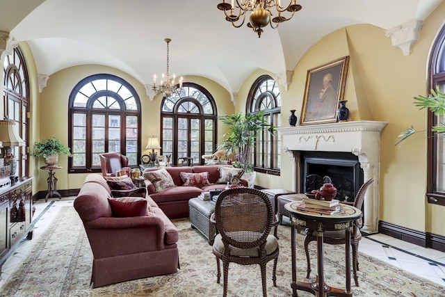 tiled living area featuring a wealth of natural light, a chandelier, and baseboards