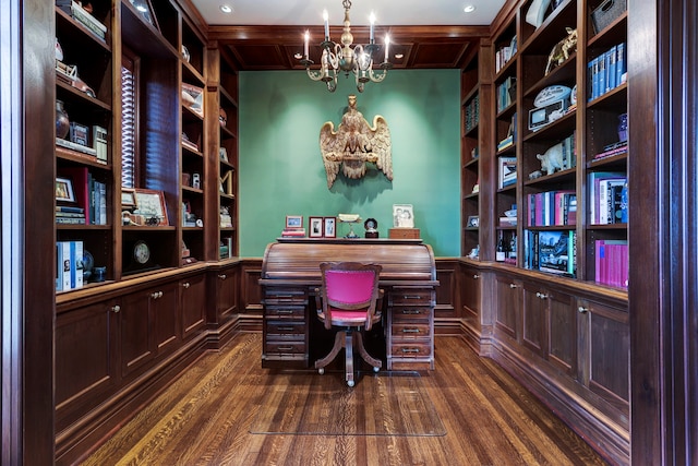 office with dark hardwood / wood-style flooring and an inviting chandelier