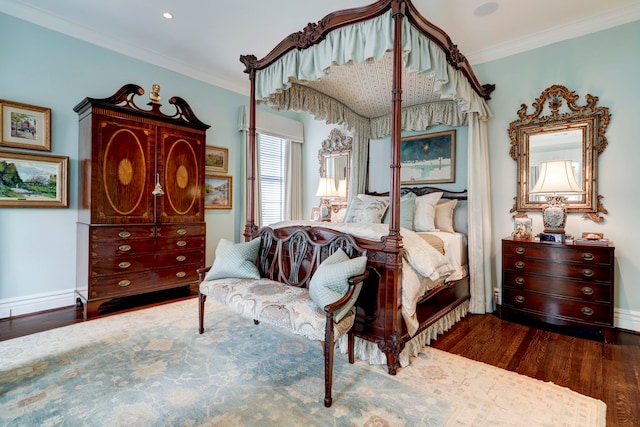 bedroom with ornamental molding and dark hardwood / wood-style flooring