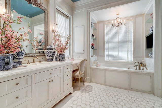 bathroom featuring vanity, a chandelier, plenty of natural light, and a washtub