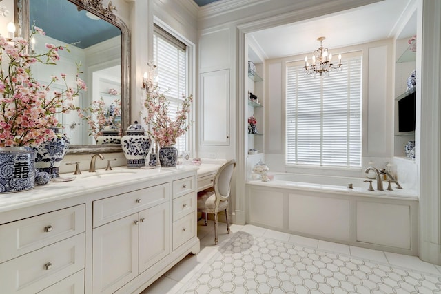 full bath with a chandelier, a healthy amount of sunlight, a bath, and vanity