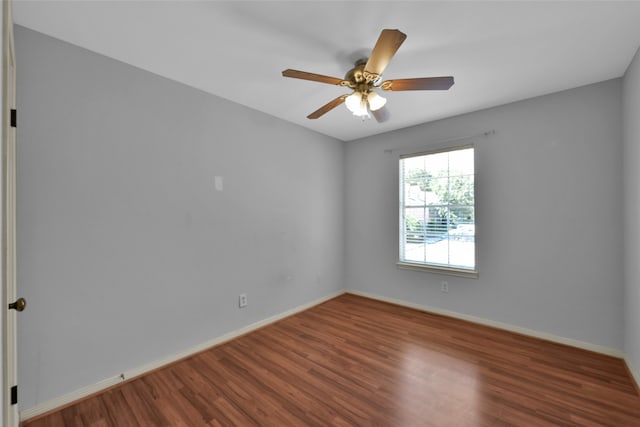 spare room with ceiling fan and wood-type flooring