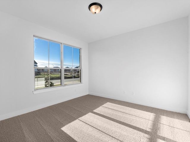 unfurnished room featuring carpet flooring