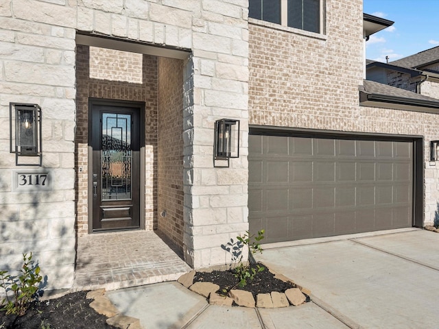 doorway to property featuring a garage