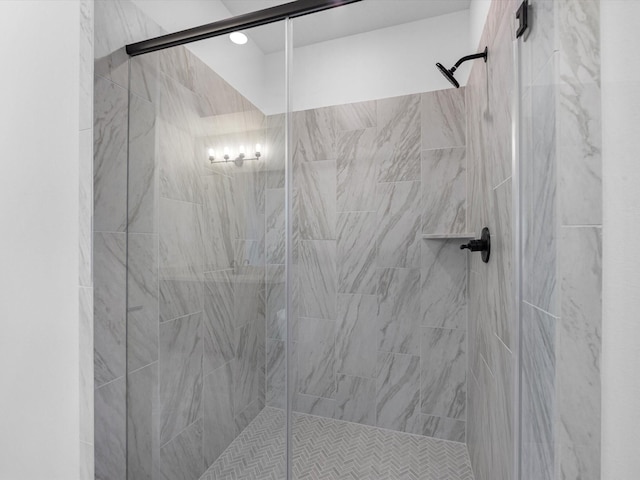 bathroom with a shower with shower door