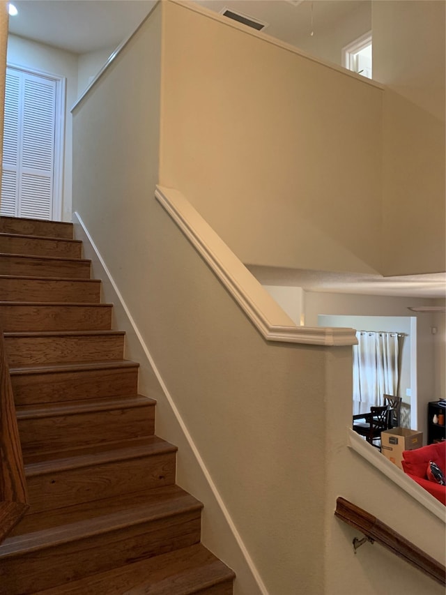 staircase with a high ceiling